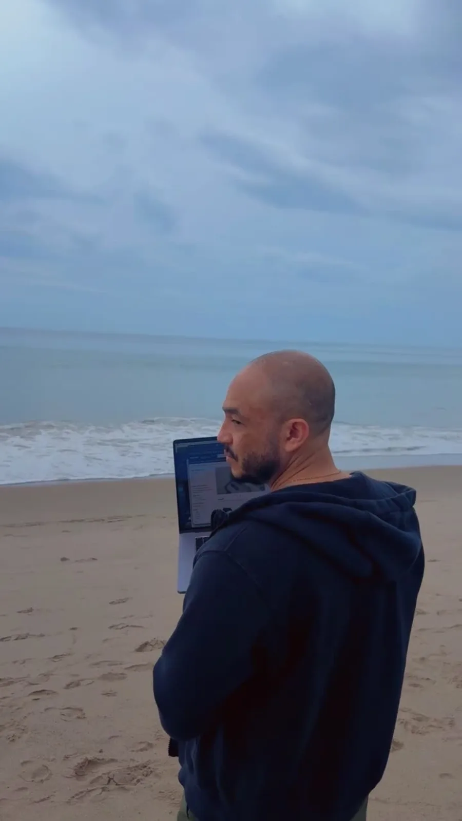 Ken Eckman working remotely with a laptop while thinking through client positioning